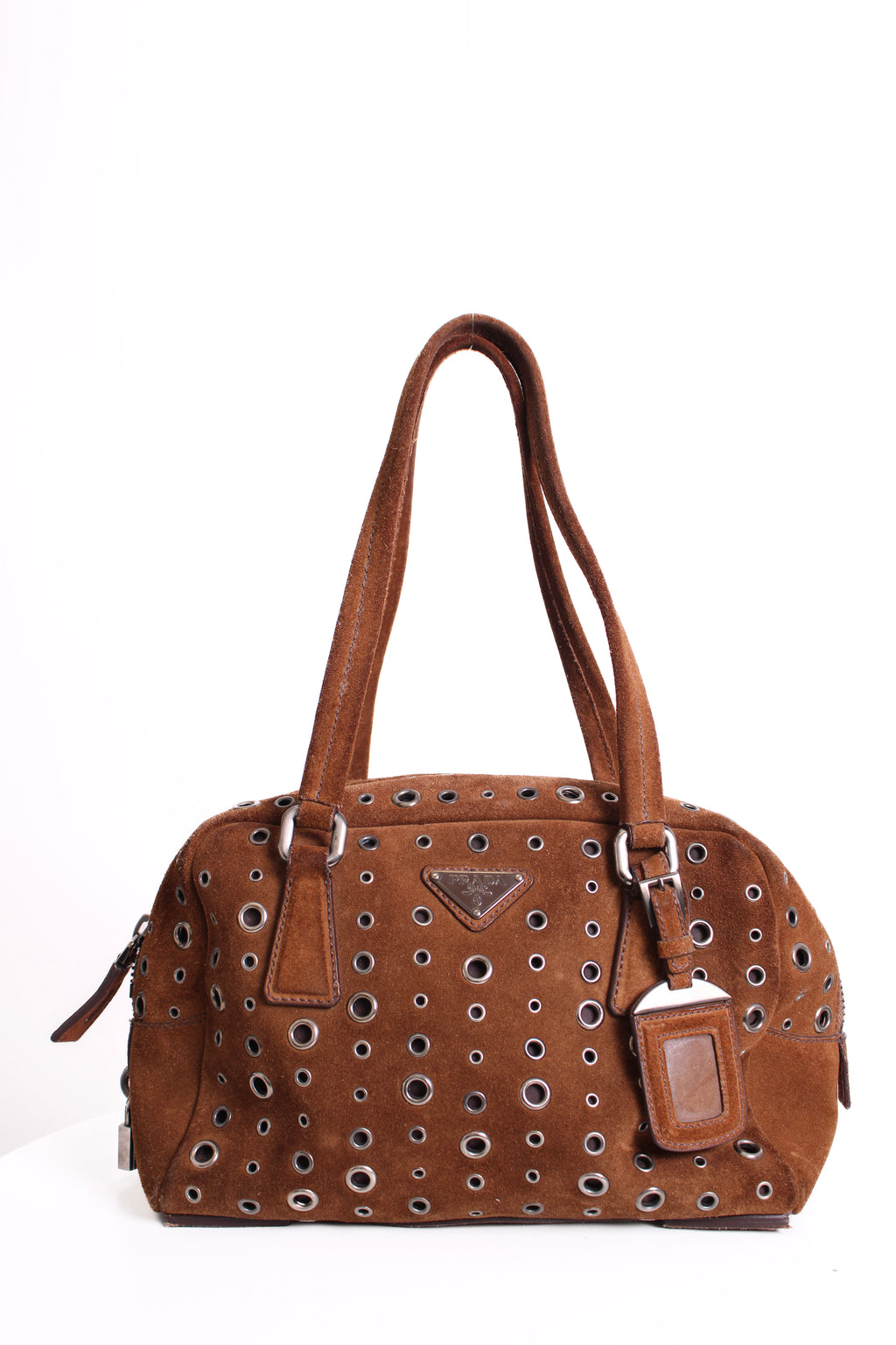 Brown handbag with decorative studs on a white background